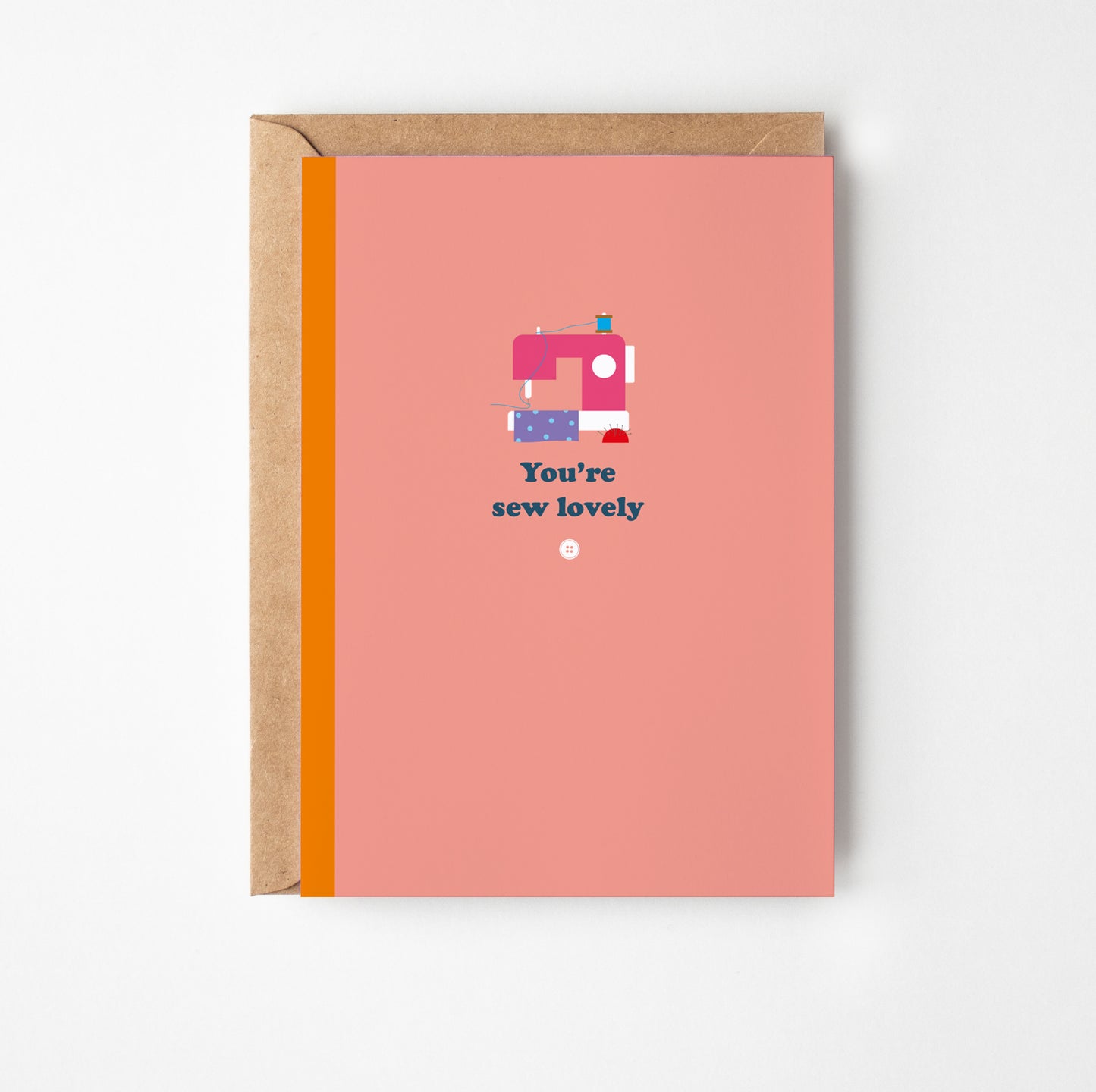 Greeting card with sewing machine illustration and text on a pink background