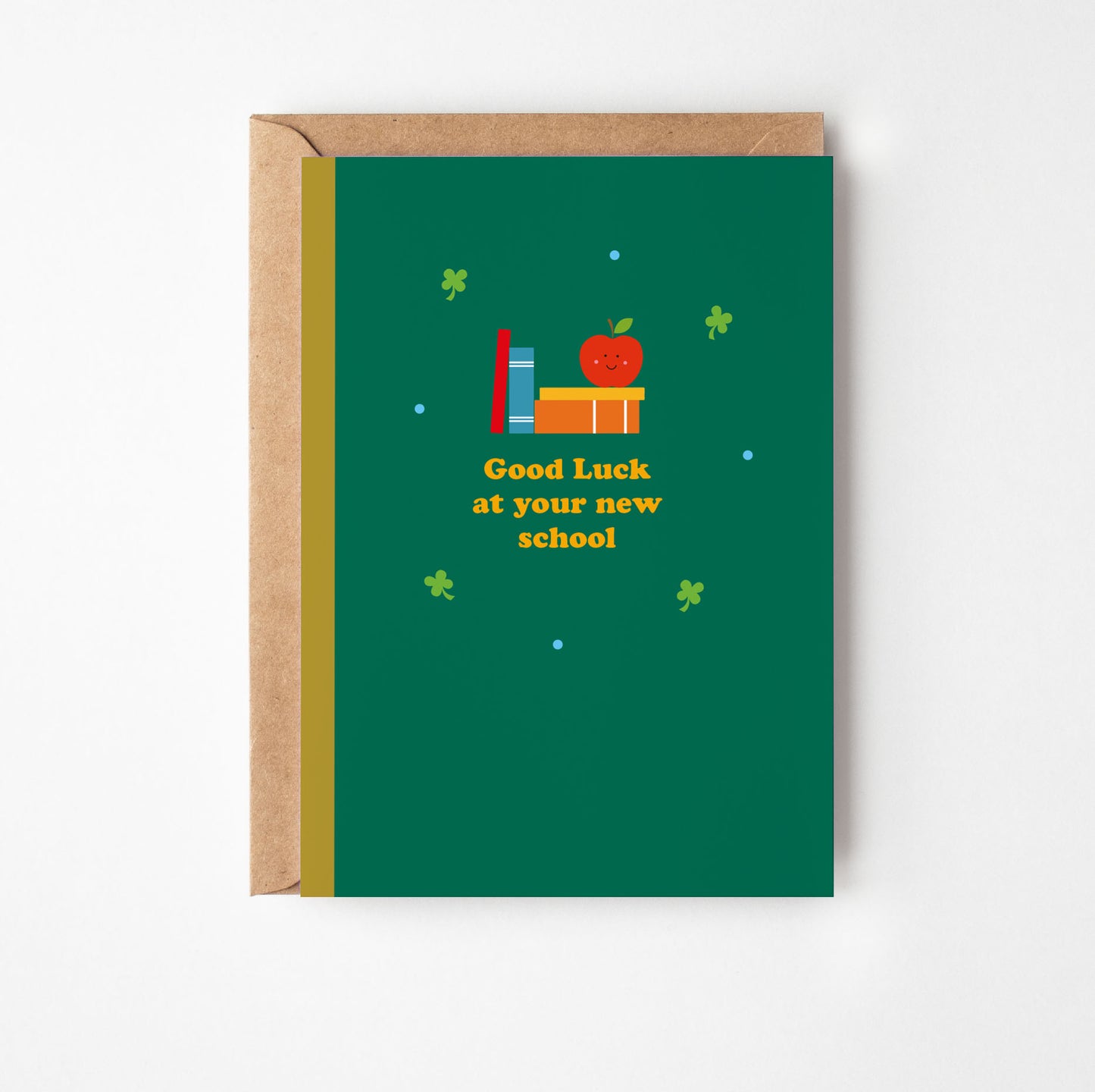 Green greeting card with 'Good Luck at your new school' text and illustrations on a white background