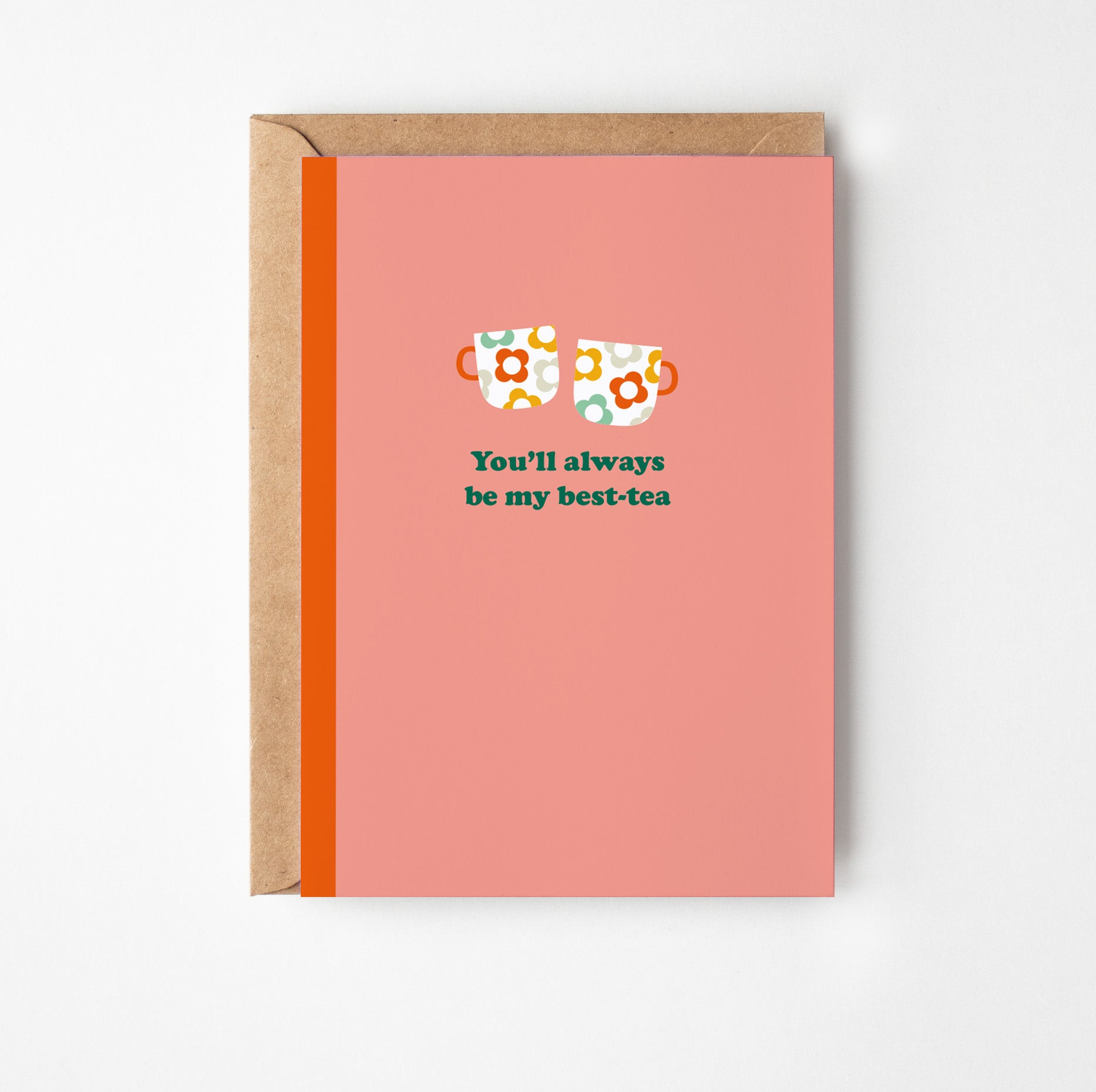 Greeting card with floral tea cups and text on a pink background