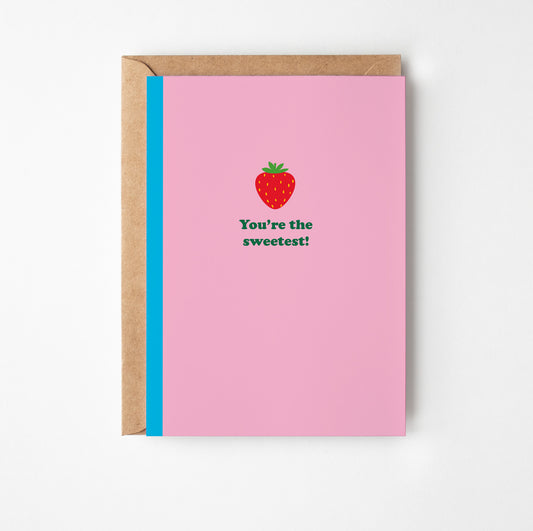 Greeting card with strawberry illustration and text on pink background