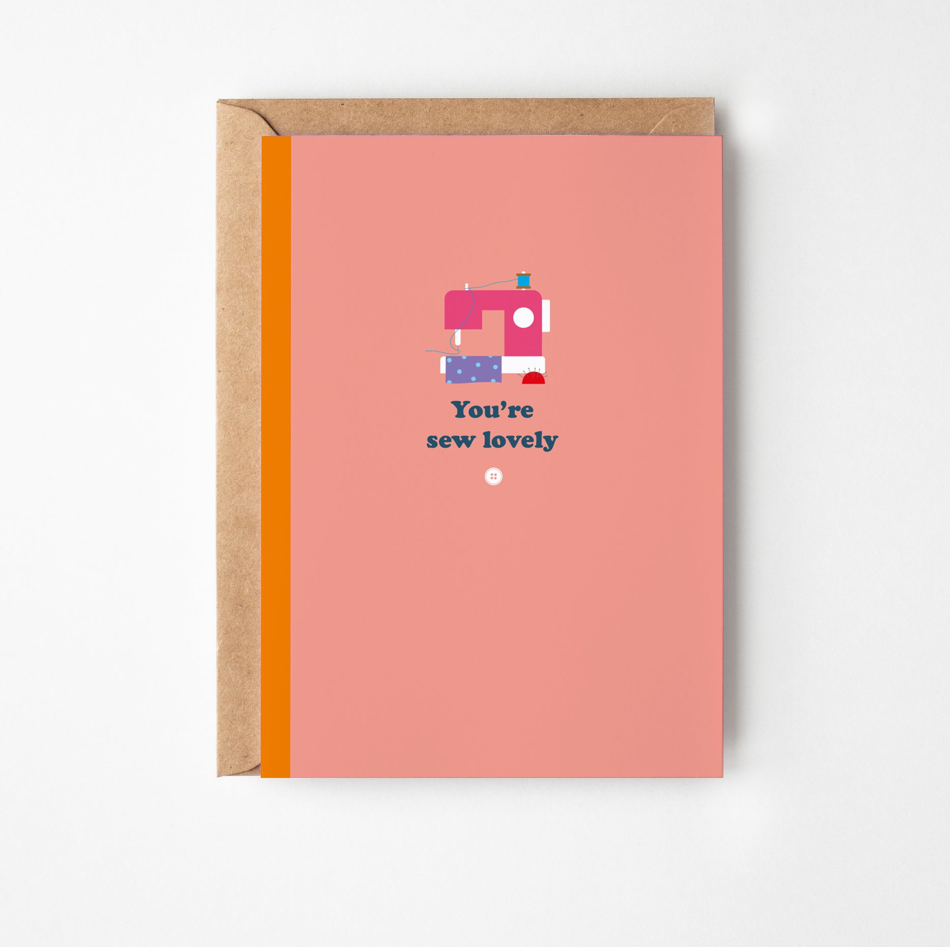 Greeting card with sewing machine illustration and text on a pink background