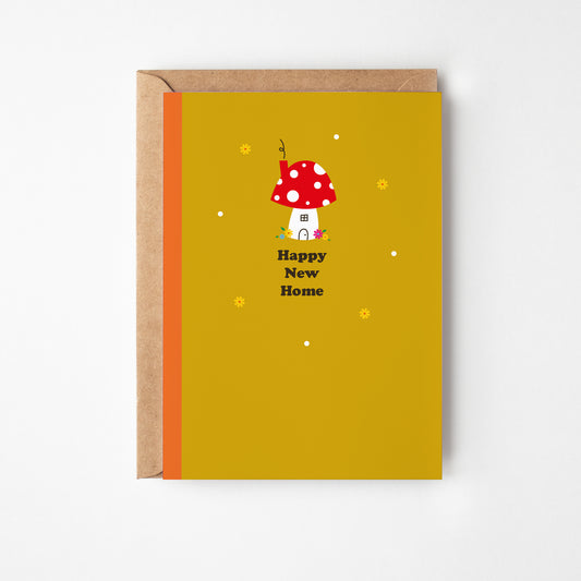 Greeting card with mushroom design and 'Happy New Home' text on a yellow background
