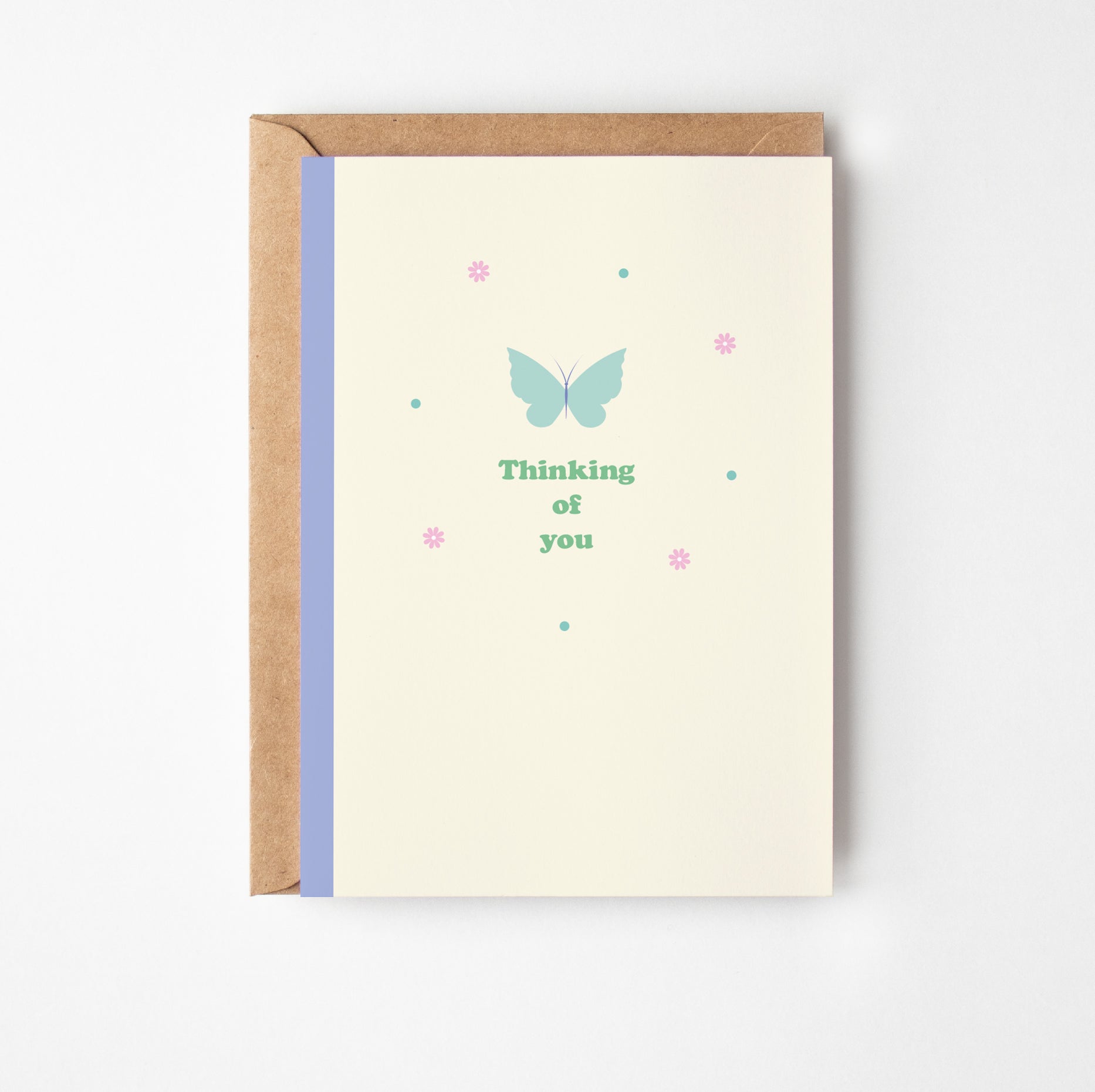 Greeting card with butterfly design and text 'Thinking of you' on a white background
